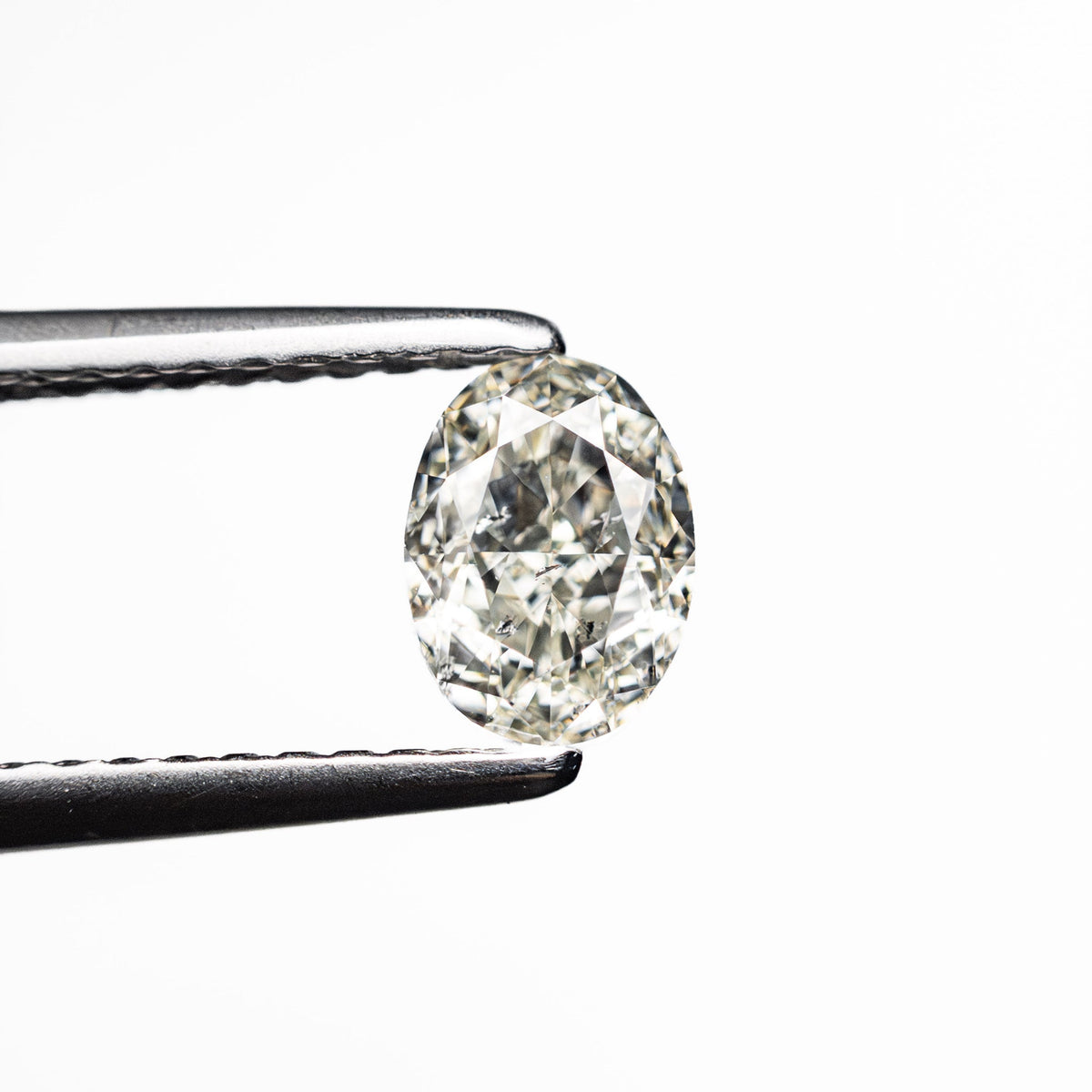 0.70ct Natural Warm K/SI2 Oval Brilliant Diamond